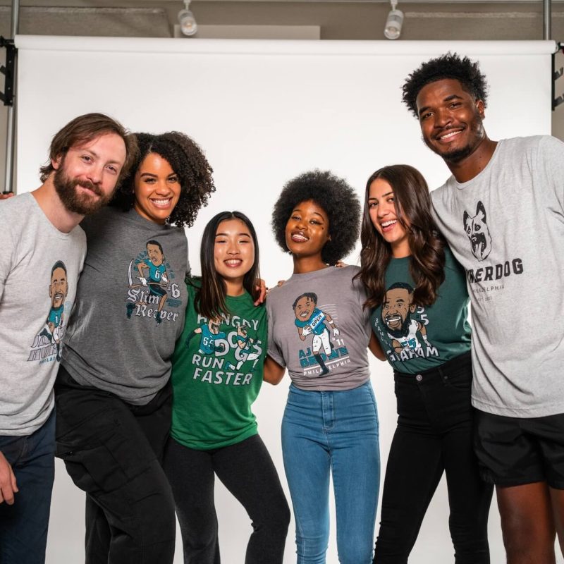 Six diverse male and female models modeling the Underdog Apparel line